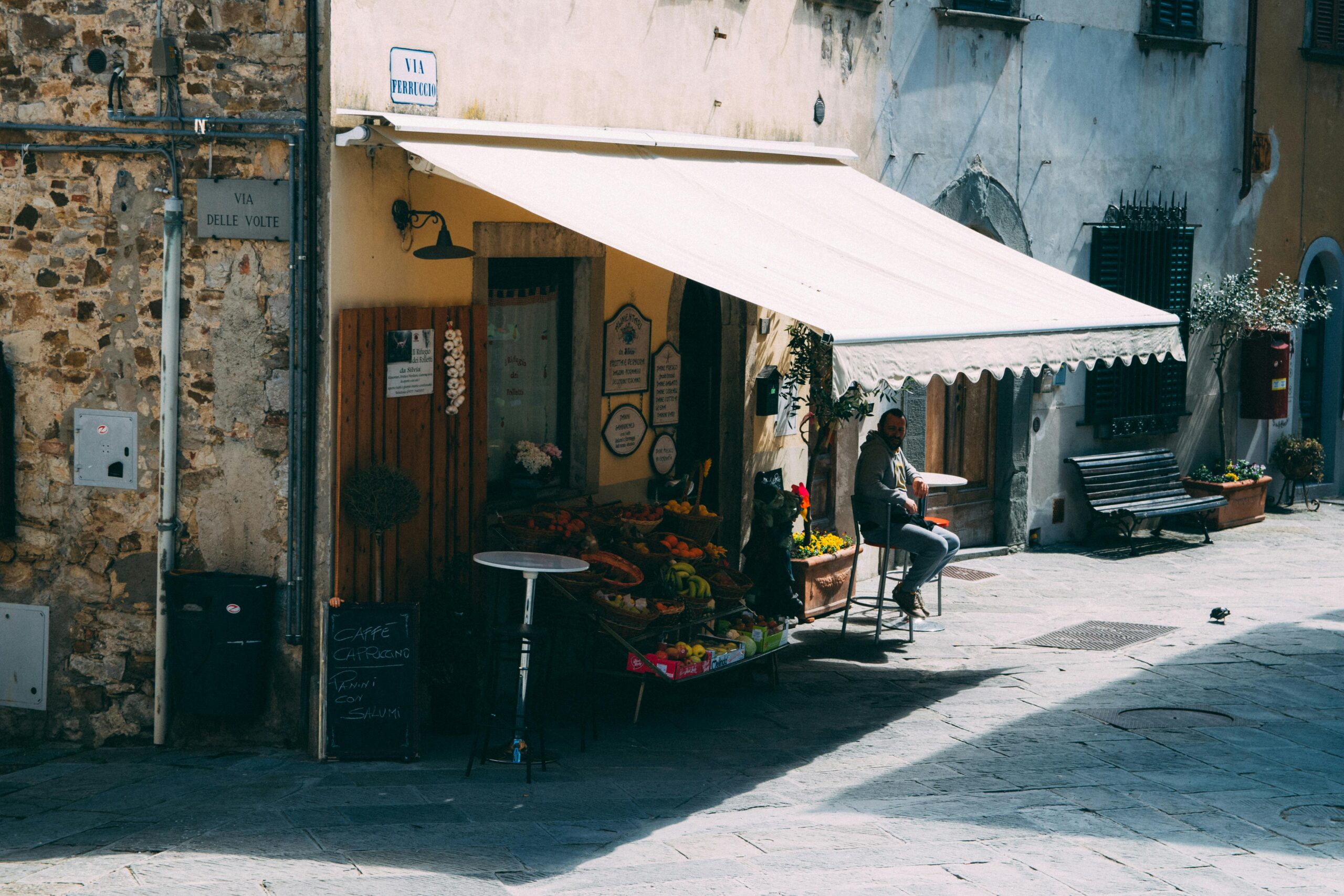 Outdoor market in Rome, Italy with fresh produce and a sunny ambiance. Perfect for travel and culture themes.